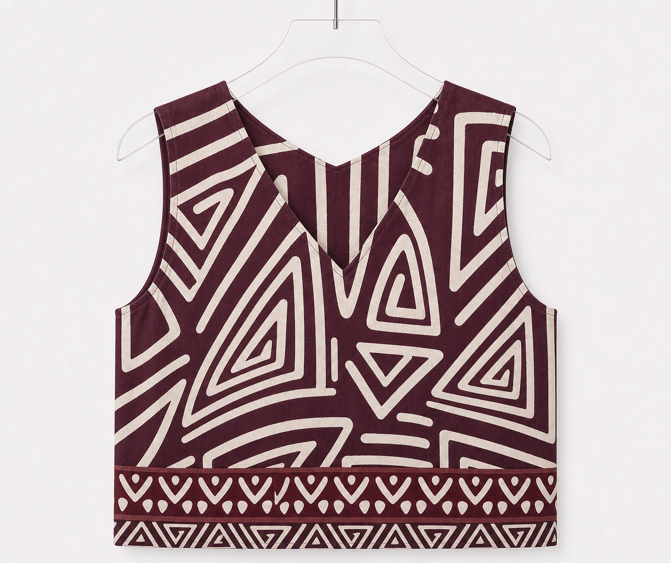Top smanicato con stampa geometrica e bordo a contrasto